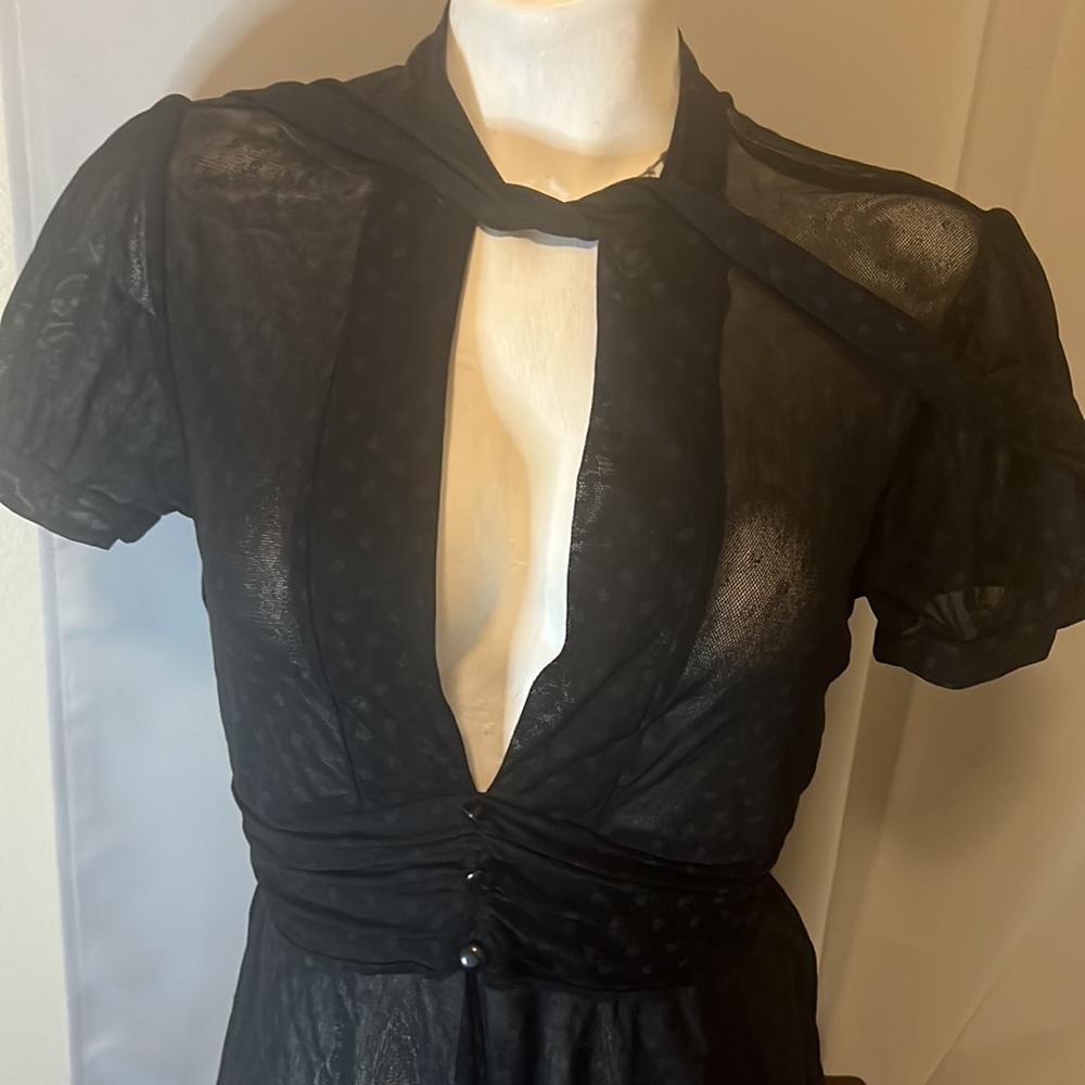 Women’s black sheer polka dot blouse with tie strings on the neck for bow